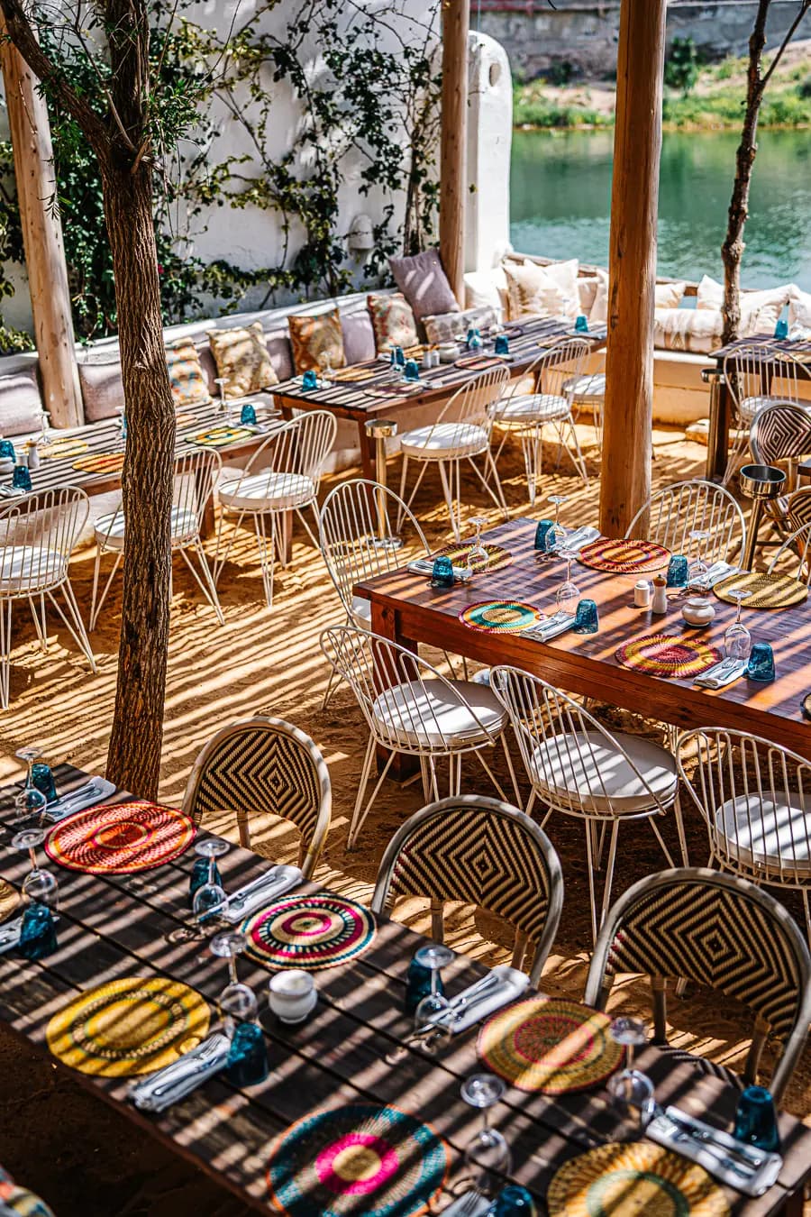 Mykonos-inspired boho-chic lounge setup offering a relaxing VIP desert oasis experience