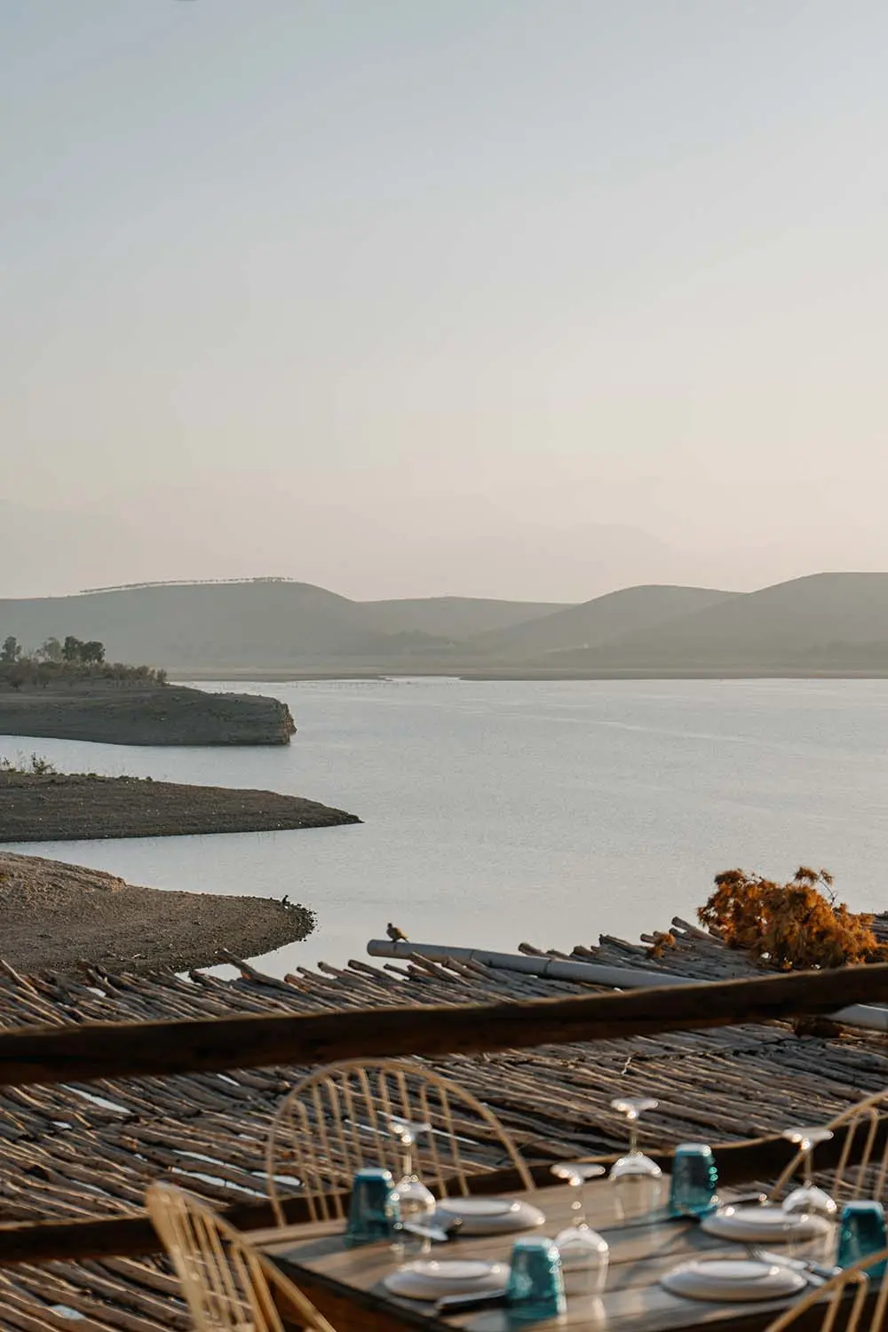 Romantic sunset reflection on Lac Takerkoust during a private lakeside dinner