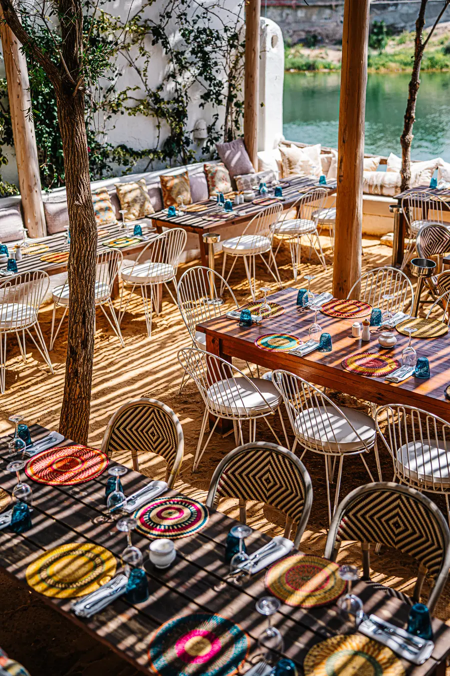 Mykonos-Inspired Boho-Chic Lounge Oasis Mykonos-inspired boho-chic lounge setup offering a relaxing VIP desert oasis experience